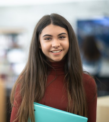 Student holding folder